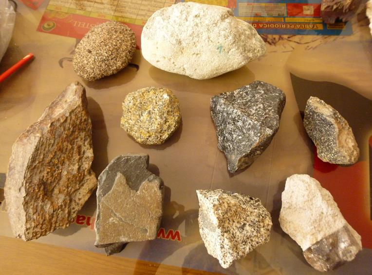 Igneous rocks - From top left to bottom -granodiorite, andesite, syenite, gabbro, rhyolite, basalt, granite and an ignimbrite